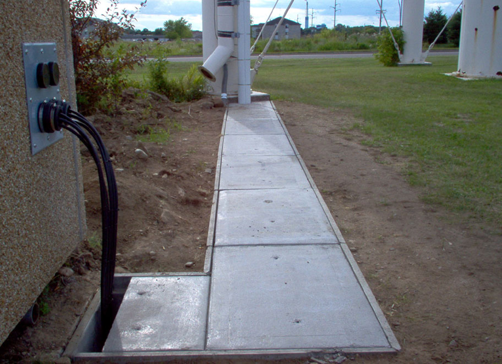 Custom concrete covers used to replace covers in light traffic H10