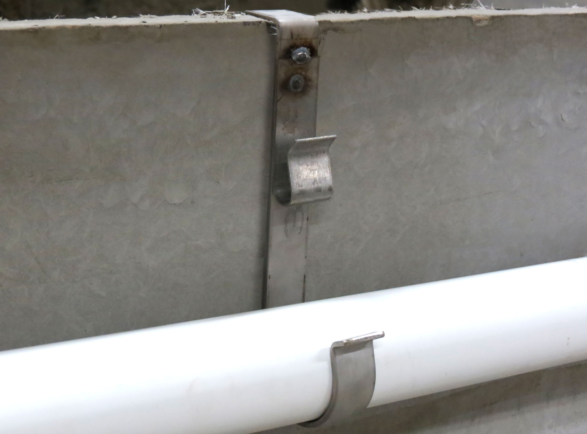 Stainless steel cable clips designed to mount grounding cables and PVC