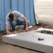 Photo Link of a person verifying that the modular flat pad is level