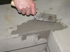 Photo of a small cosmetic patch being applied to a flat pad.